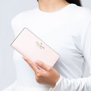 KATE SPADE
Staci Large Slim Bifold Wallet Chalk Pink